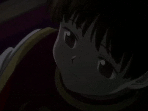 a close up of a young girl 's face in the dark .