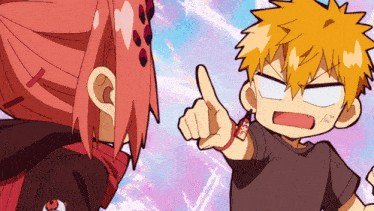 a boy and a girl are standing next to each other with the boy pointing at the girl