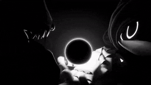 a black and white photo of a robot 's face with a glowing circle in the background .