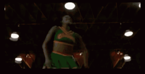 a group of cheerleaders are dancing on a stage