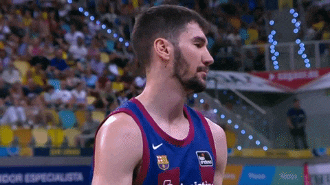 a basketball player wearing a jersey that says " fcb " on it