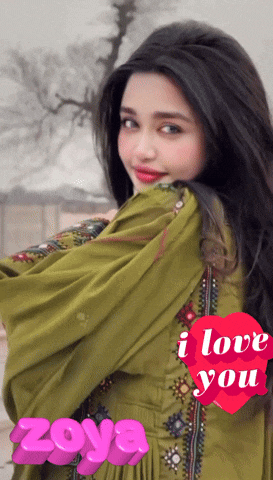 a woman in a green dress with a heart that says i love you