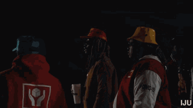 a group of people wearing hats and jackets with the word iju on the bottom right