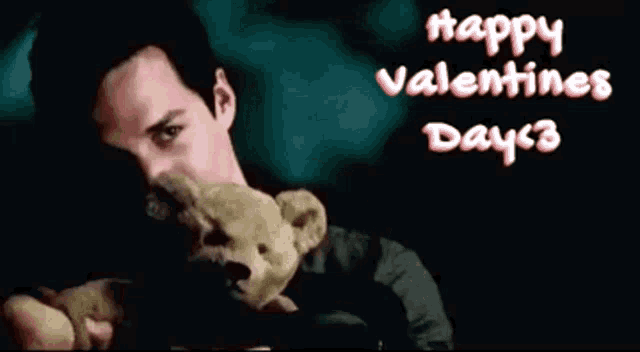 a man holding a teddy bear with the words happy valentine 's day < 3