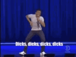 a man is dancing on a stage with the words dicks dicks dicks dicks in the background