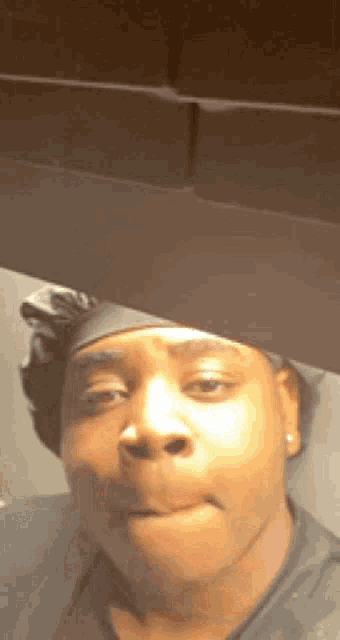 a close up of a person making a funny face with their mouth open .