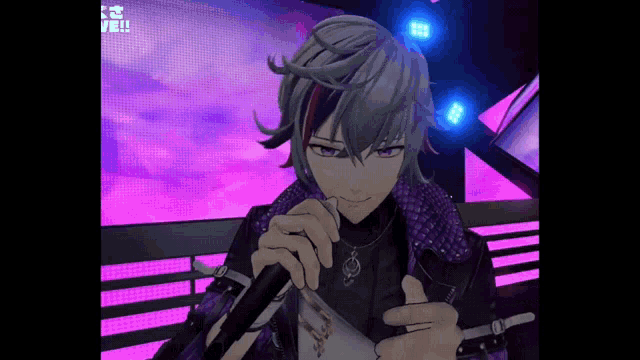 a man in a purple jacket is singing into a microphone on a stage .
