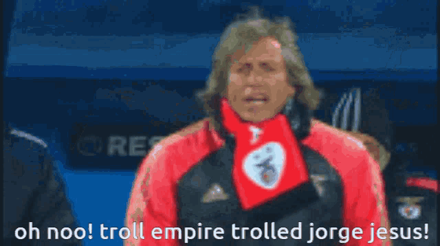 a blurred image of a man with the words oh noo troll empire trolled jorge jesus at the bottom