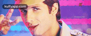 a close up of a man 's face with the words kulfyapp.com on the bottom
