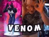 a statue of venom is next to a man giving an ok sign