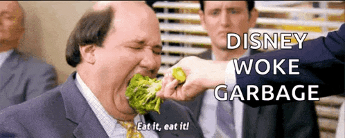 a man in a suit and tie is eating broccoli with the words disney woke garbage behind him