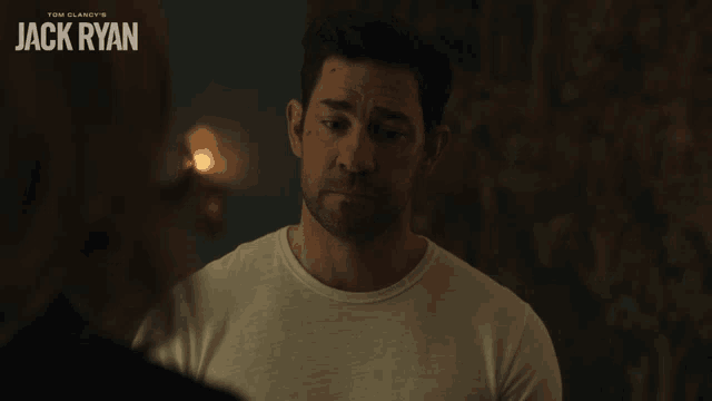 a man in a white shirt with the name jack ryan on it