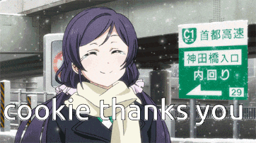 a girl stands in front of a green sign that says cookie thanks you