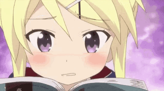a close up of a girl reading a book with purple eyes .