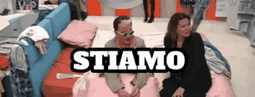 a man and a woman are sitting on a bed with the words stiamo above them