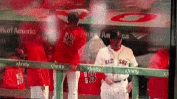 a blurred image of a baseball player with the number 19 on his jersey