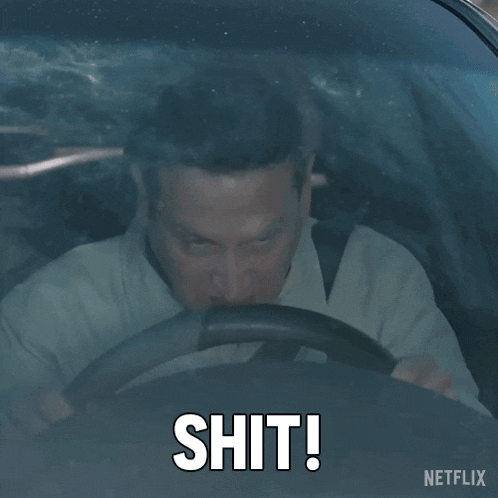 a man is driving a car and says shit on the screen