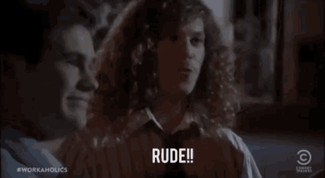 a man with curly hair says rude in a comedy central advertisement