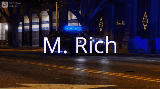 a car is driving down a street with the words m. rich written on it