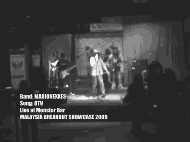 a black and white photo of a band called marionexkes live at monster bar malaysia breakout showcase 2009