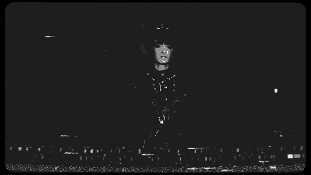 a black and white photo of a woman standing in front of a barcode