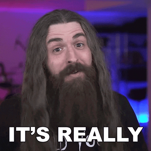 a man with long hair and a beard has the words it 's really on his face