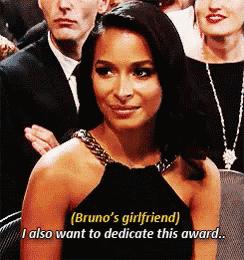 a woman in a black dress says " bruno 's girlfriend ) i also want to dedicate this award "