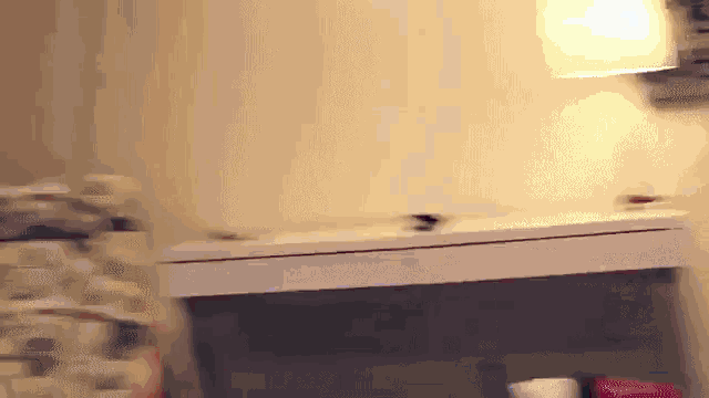 a blurred image of a lamp and a table
