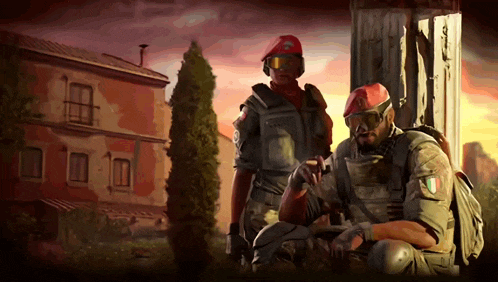 two soldiers are standing in front of a building with one wearing a red beret with the letter c on it