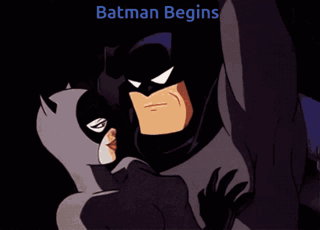 a cartoon of batman and catwoman with the words batman begins below them