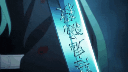 a close up of a sword with chinese characters on it