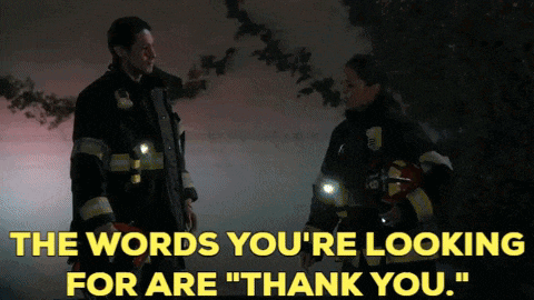 two firefighters are standing next to each other with the words " the words you 're looking for are " thank you "