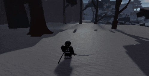 a person standing in the snow with a light shining on them