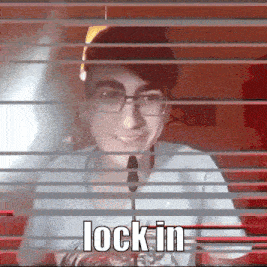 a man with glasses and a microphone behind blinds with the words lock in on the bottom