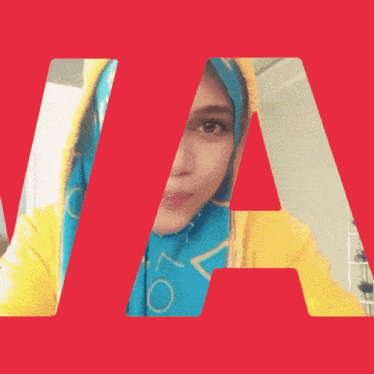 a woman wearing a yellow hoodie and a blue scarf has the word love on it