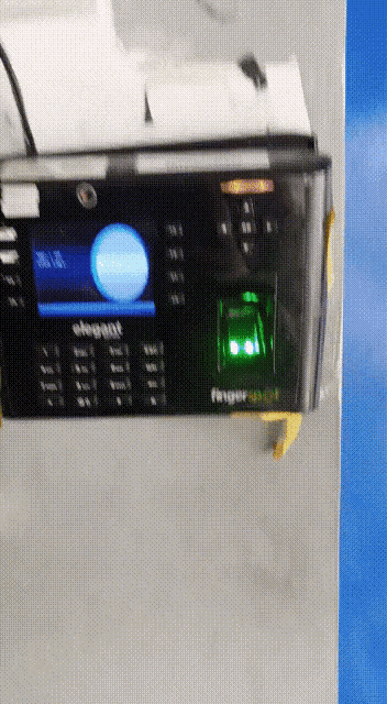 a fingerprint scanner with a green light on it
