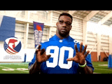 a man wearing a blue jersey with the number 90 on the front