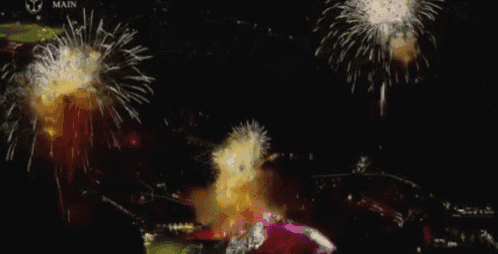 fireworks are displayed in the night sky with the word main visible