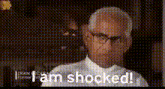 a man with glasses says i am shocked .