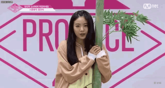a girl is standing in front of a sign that says pro