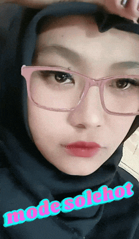 a woman wearing glasses and a black hijab with the words modesolchon written on the bottom
