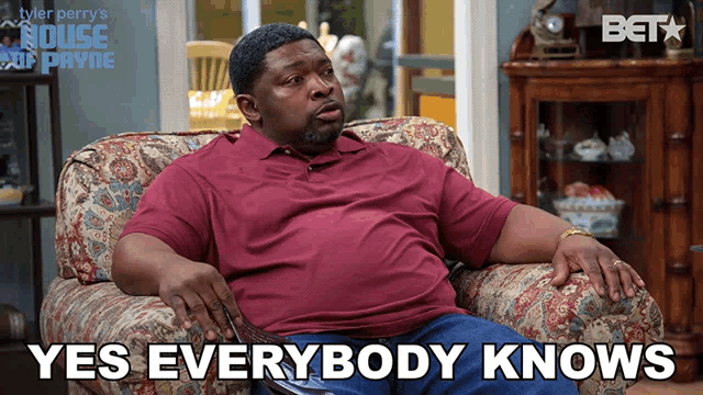 a man sitting on a couch with the words " yes everybody knows " below him