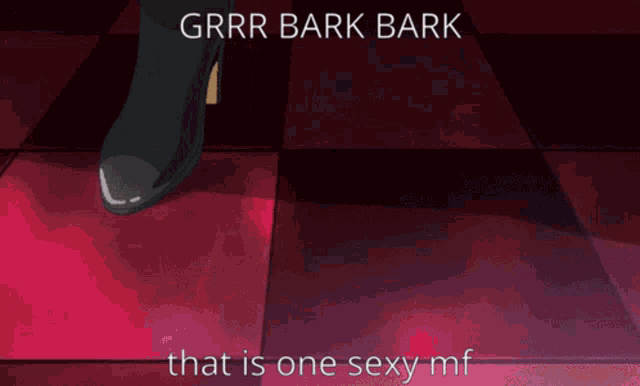 a man in a suit is standing in front of a couch with the words " grrr bark bark that is one sexy mf "