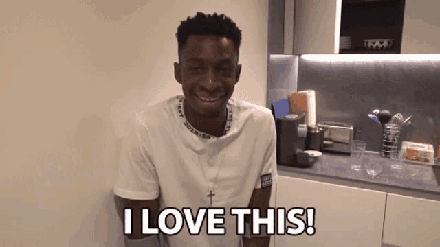 a man in a kitchen with the words i love this written on the bottom