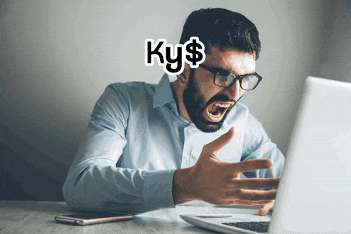 a man with glasses is screaming in front of a laptop with the word ky $ written above his head