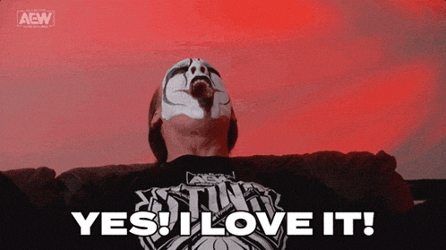 a man with a mask on his face is laying on a couch and saying yes i love it