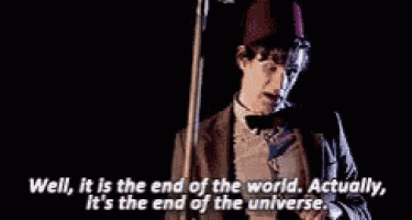 a doctor is holding a doll and says well it is the end of the world actually it 's the end of the universe