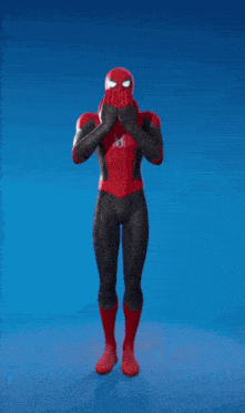 a spiderman is dancing on a blue background in a video game .
