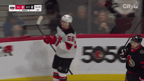 a hockey player with the number 56 on his jersey is on the ice