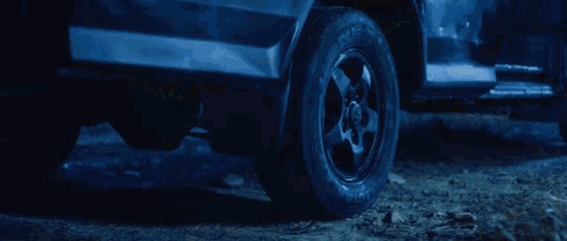 a close up of a tire on a vehicle in the dark